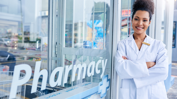 Female Pharmacist Standing in Front of Store