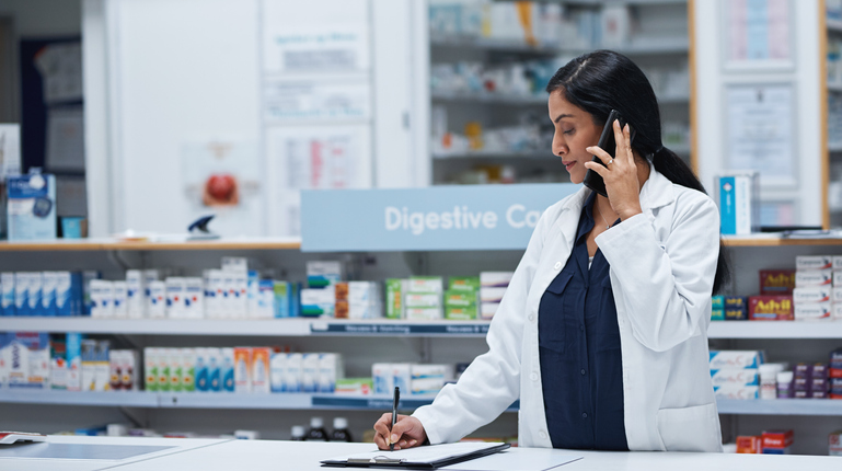 Female Pharmacist Talking on Phone