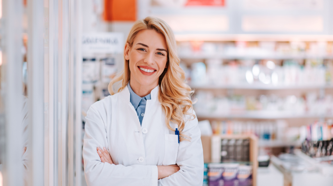 Young Woman Pharmacist  in Front of Pharmacy